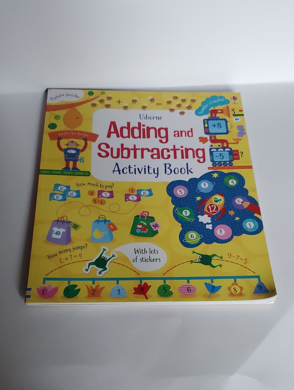 Usborne Adding and Subtracting Activity Book - Paperback